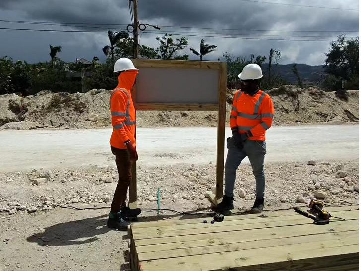 Roots & Rise field crew working on an active construction site in Jamaica